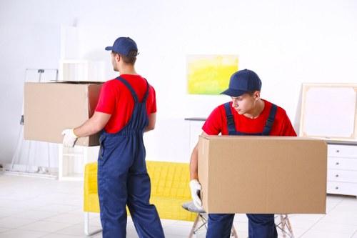 Office removals planning in Swiss Cottage with packed boxes and workplace furniture