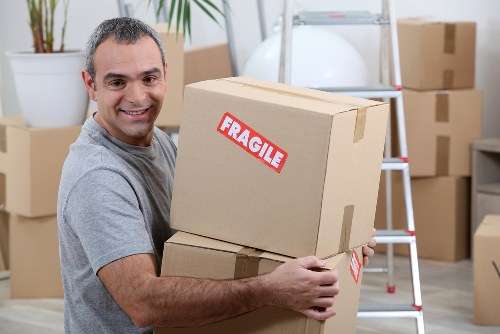 Careful loading of household items into a moving van