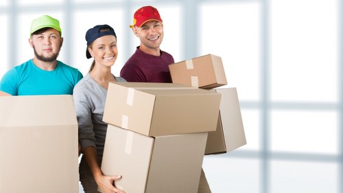 Office relocation equipment and boxes prepared for a commercial move in Swiss Cottage