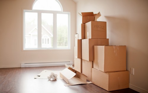 Professional movers handling household furniture during a Swiss Cottage home move