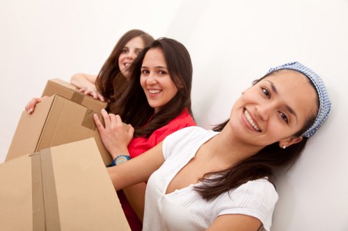Loading furniture into a removal van in Swiss Cottage