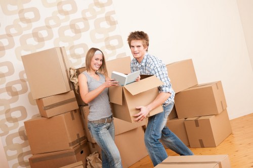 Professional movers preparing furniture for transport in Swiss Cottage